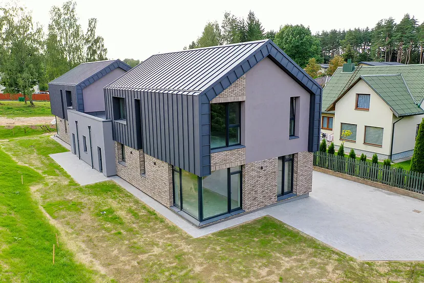 New modern house with a metal roof and large windows