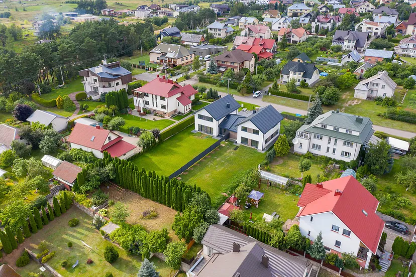 Neighborhood of family houses with gardens from the air