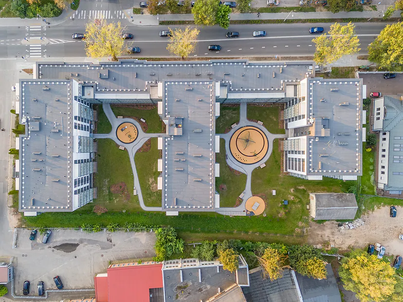 Courtyard of new apartment buildings with playgrounds, view straight from above