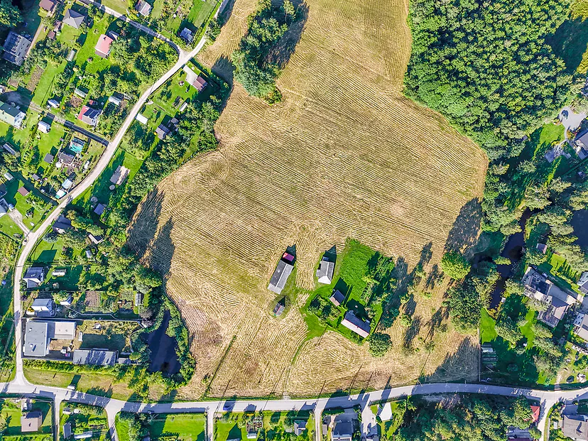 Large plot between homesteads, view straight from above