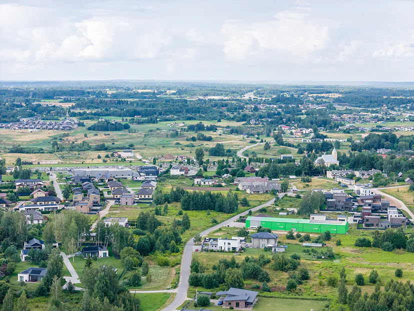 Suburban village with new houses and fields from high up