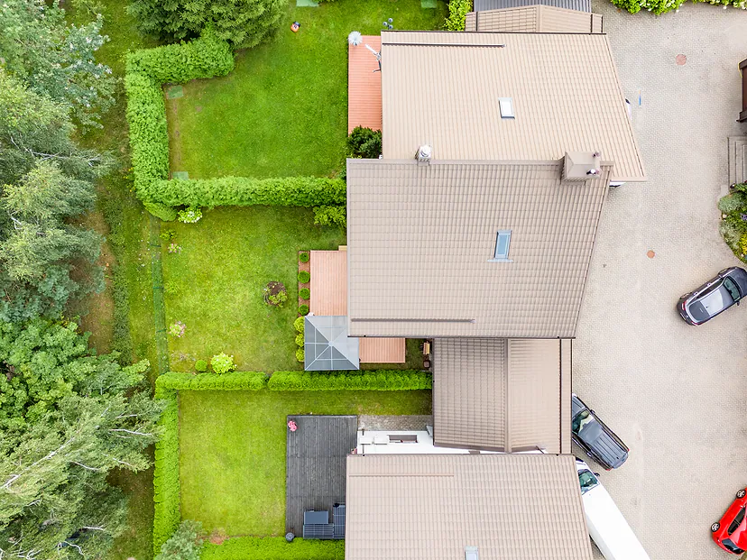 House roof and yard with a hedge, view straight from above