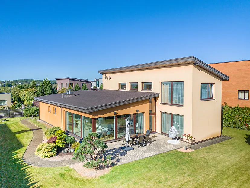 House with a terrace and garden, drone close-up