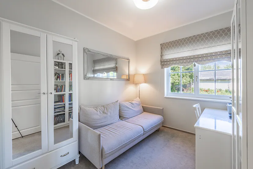 Room with a sofa and a bookcase