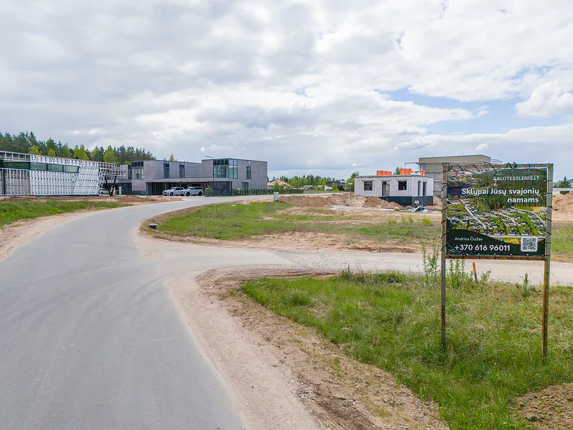Entrance to the development with a sales sign