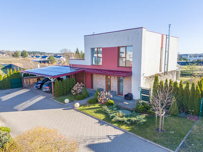 Front of the house with a carport from the air