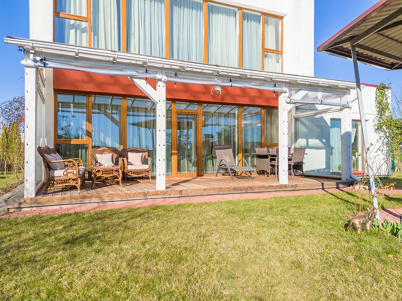 Terrace with a canopy and outdoor furniture