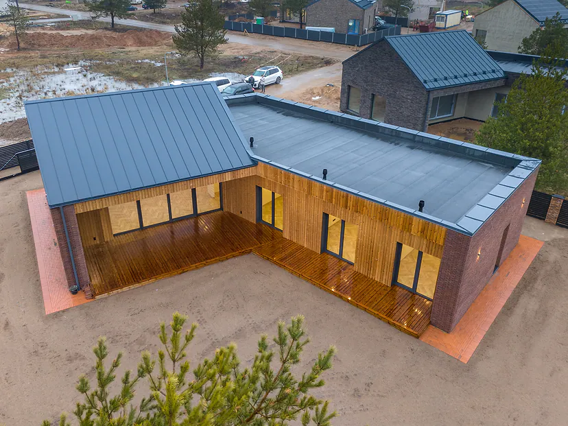 New single-story house with a terrace from the air