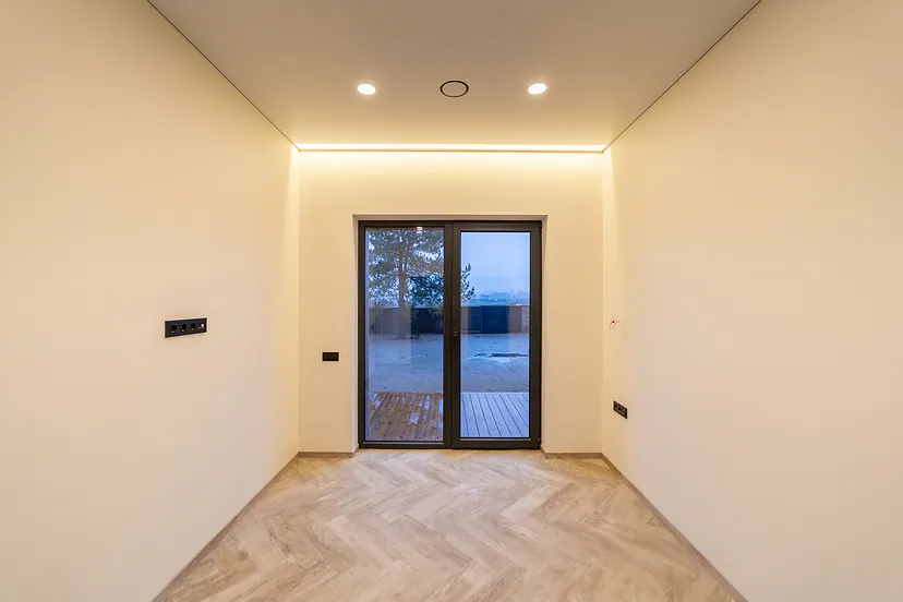 Room with a door to the terrace