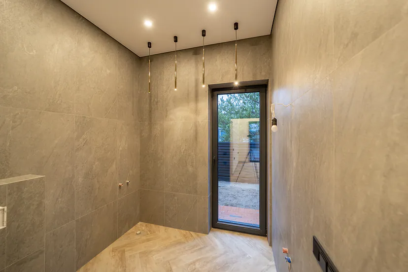 Bathroom with gray tiles