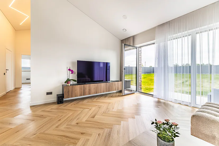 Living room with large windows facing the yard