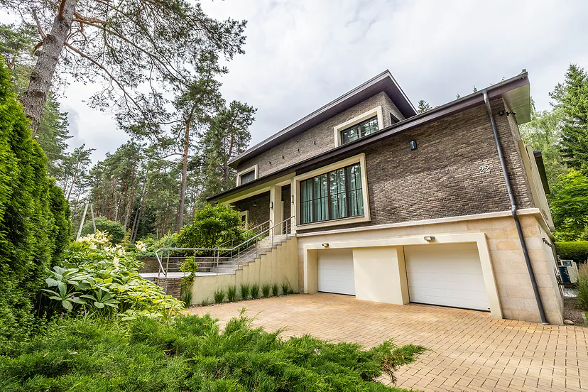 Front of the house with a double garage and steps