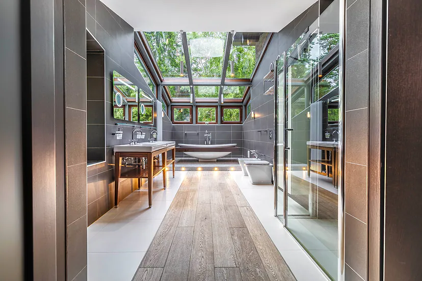 Bathroom with skylights and a freestanding bathtub