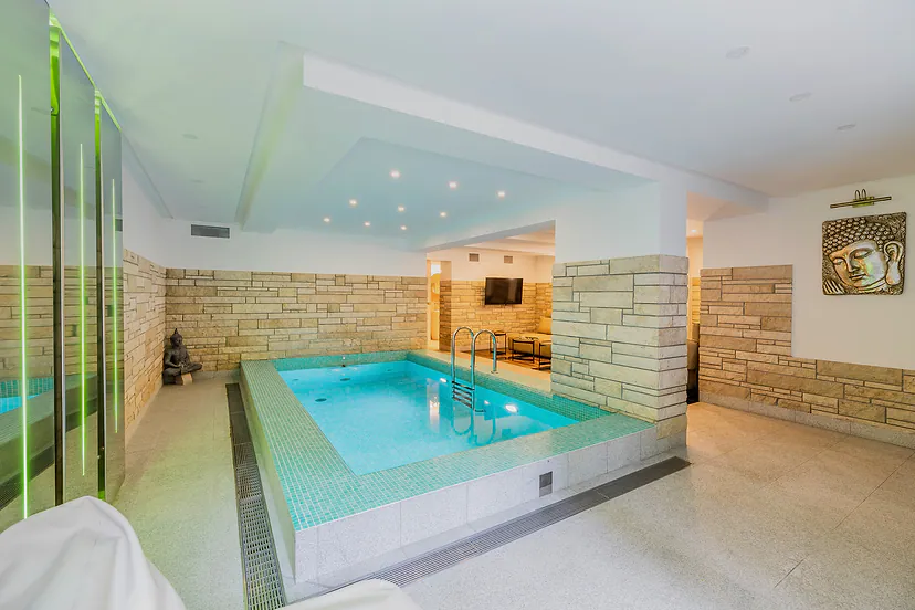 Indoor pool with stone finishes