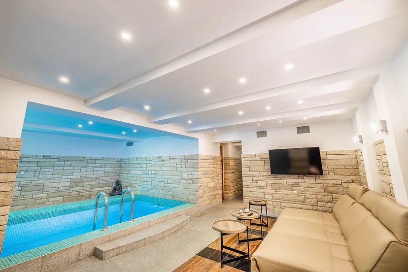 The pool and a lounge area with a TV