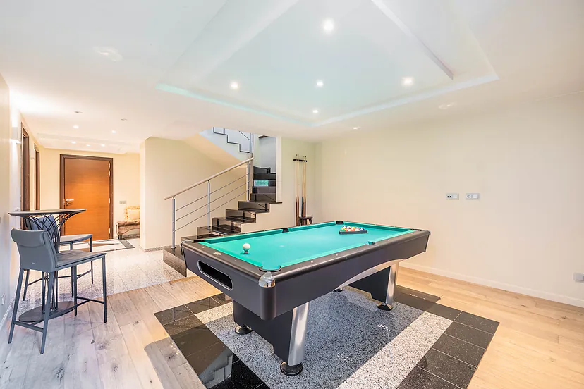 Billiard room with stairs