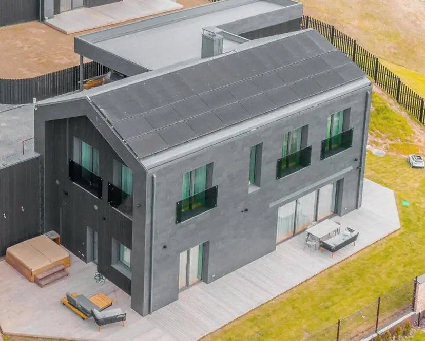 A house roof and facade up close, photographed by drone