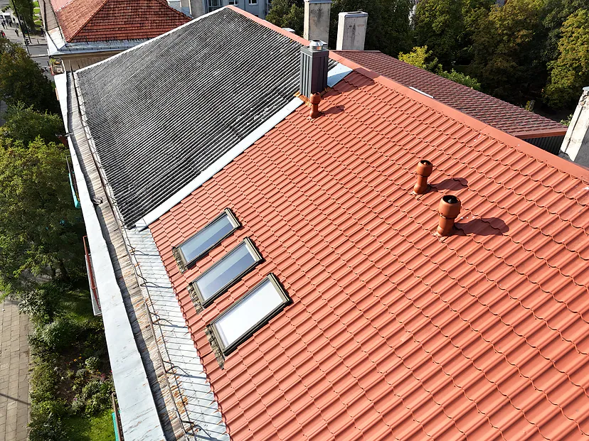 New red roofing next to old slate, drone inspection