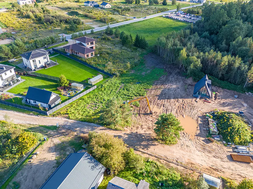 New houses and plots being prepared for building in the sunset light