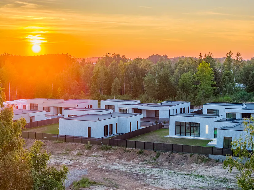 Sunset over a neighbourhood of modern single-story houses