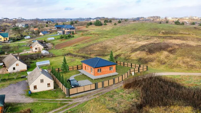 New house with an orange roof in a village, visualization in an aerial photo