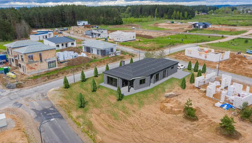 New house in a neighborhood under construction, aerial visualization