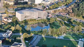 Office building by a pond at sunrise, filmed by drone (1)