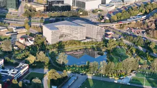 Office building by a pond at sunrise, filmed by drone (6)